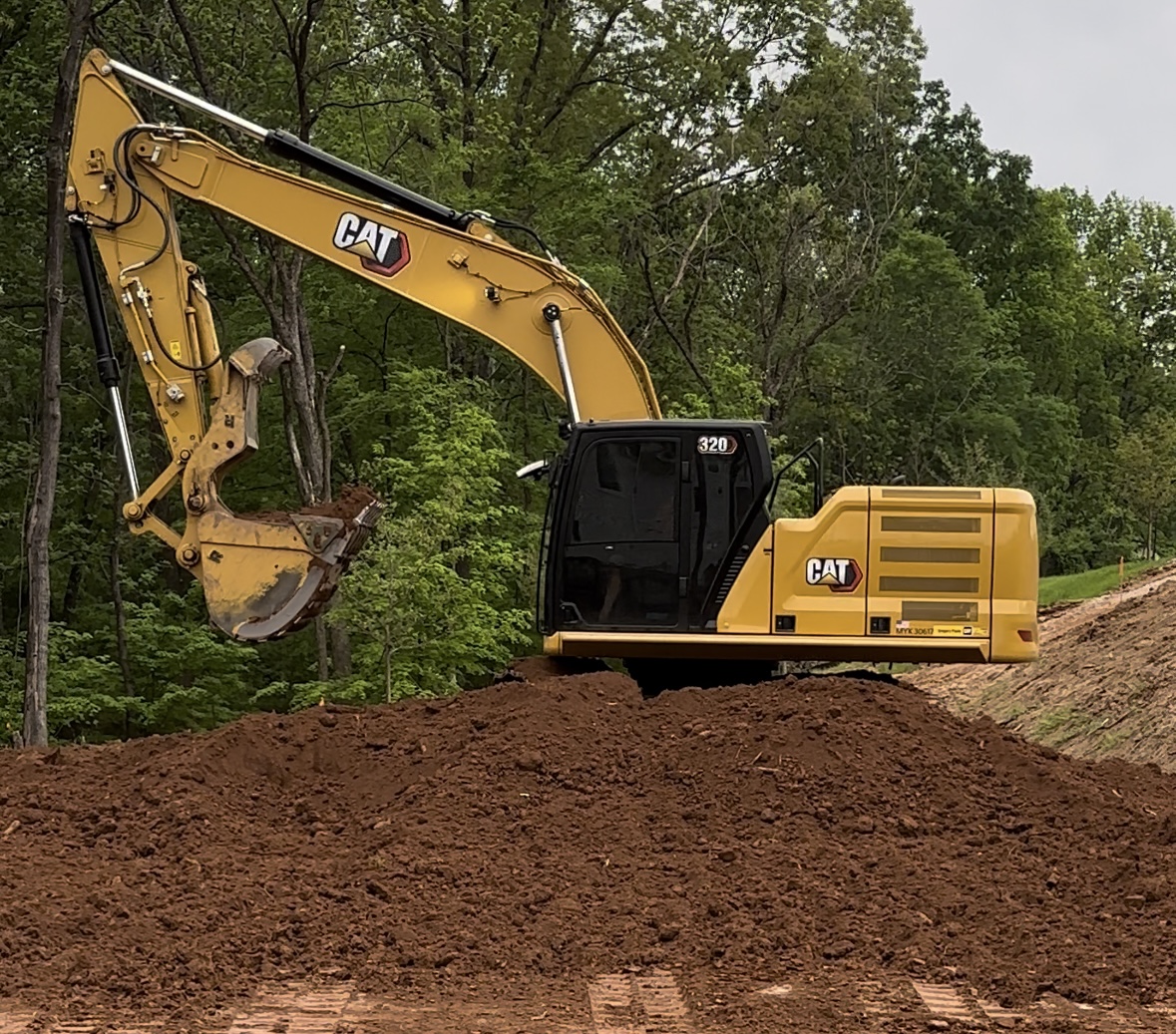 Excavator performing earthwork